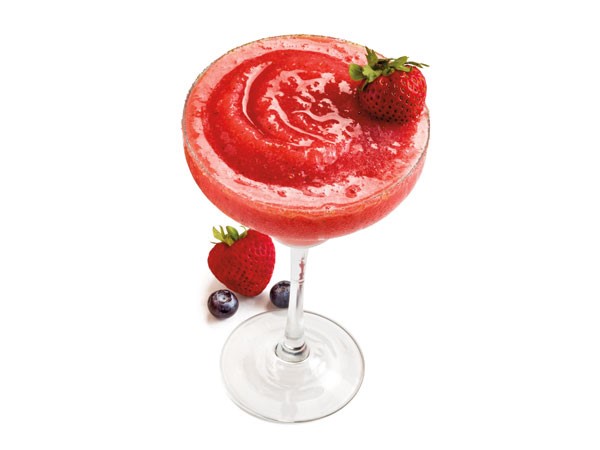 Strawberry daiquiri garnished with strawberries and blueberries