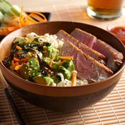Bowl of tuna, avocado, ramen noodles and shredded vegetables