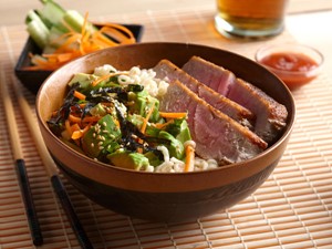 Bowl of tuna, avocado, ramen noodles and shredded vegetables
