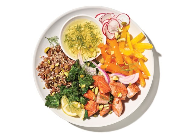 Plate of salmon, kale and grain salad
