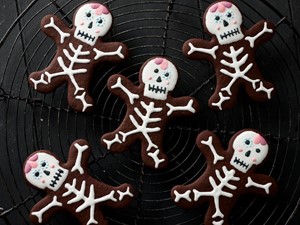 Chocolate skeleton cookies on wire rack