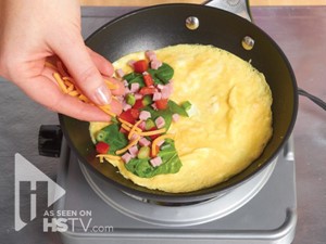 Omelet cooking in a frying pan