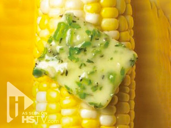 Herb butter on an ear of corn