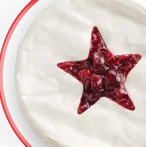 Platter of brie with star-shaped cranberry filling