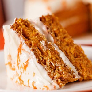 Slice of carrot cake with cream cheese frosting 