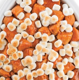 Chopped sweet potatoes topped with roasted mini marshmallows