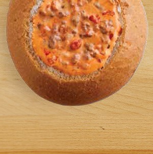 Bread bowl filled with beefy queso dip