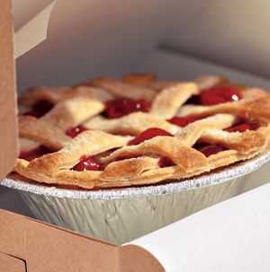 Aluminum pie plate filled with cherry pie with lattice top