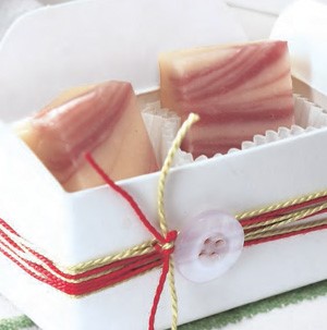 White gift box with white chocolate fudge swirled with raspberries