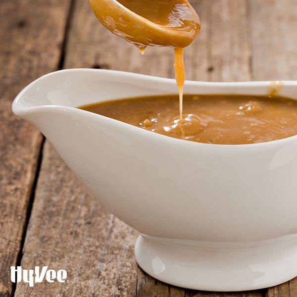 White gravy boat filled with turkey gravy