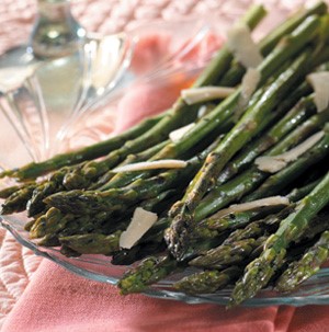 Roasted asparagus on clear glass plate