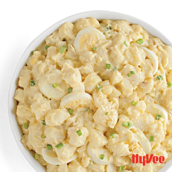 Bowl of Potato Salad topped with Green Onions