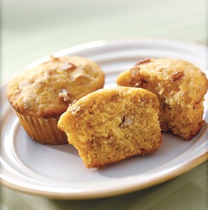 Two pumpkin muffins served on a plate