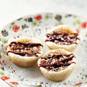 Plate of Pecan Tarts drizzled in Chocolate