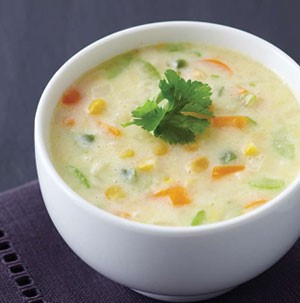 Cup of chowder, garnished with cilantro