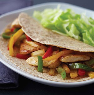 Plate of Chicken and Pepper Fajitas served with Lettuce