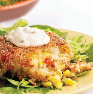 Corn-Crab Cakes topped with Chipotle Cream on a bed of Lettuce