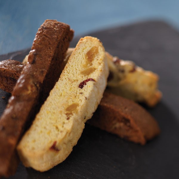 Chocolate and vanilla biscotti on a black plate