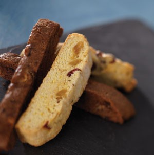 Vanilla and dried fruit biscotti next to chocolate biscotti