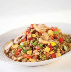 Lentils opped with mushrooms and sliced vegetables