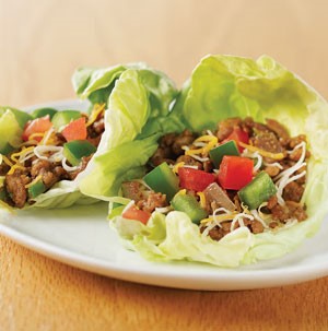 Lettuce leaves stuffed with ground meat, diced peppers, and shredded cheese