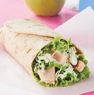 Chicken Caesar Wrap on parchment paper