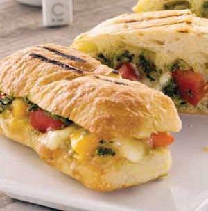 Grilled rolls filled with pesto, tomatoes, and cheese