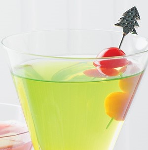 Glass filled with light green drink and garnished with fresh melon balls