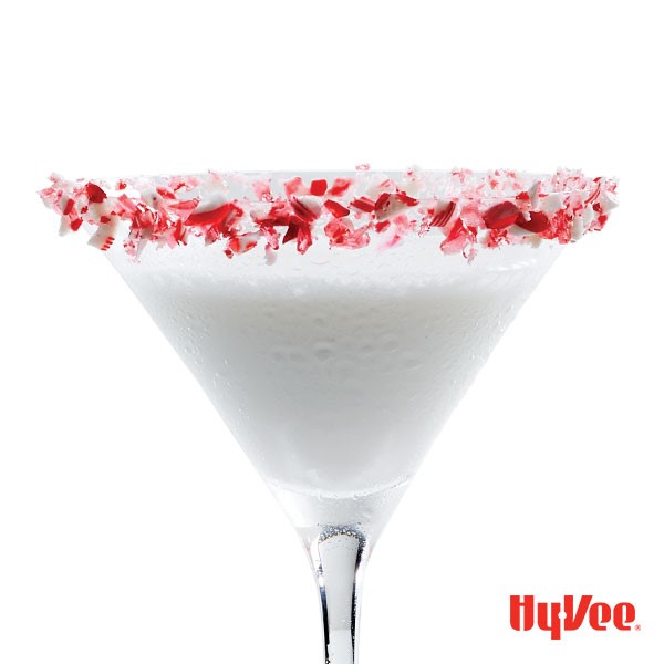 Crushed Candy Cane-rimmed martini glass filled with white Candy Cane Martini