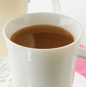 Hot buttered rum in white mug