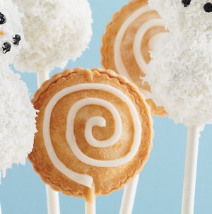 Pie-shaped cake pops with white frosting swirl