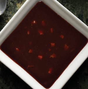 Hoisin dipping sauce in a white square dish