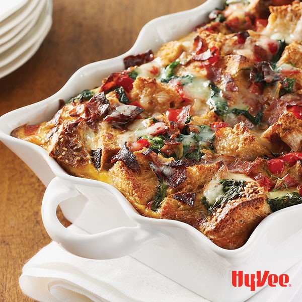 Egg strata filled with spinach, bacon and havarti