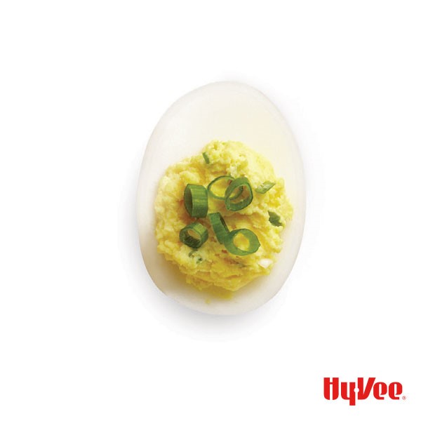 Crunchy pickle deviled egg topped with green onion slices