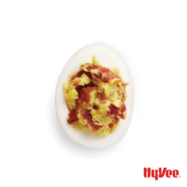 Hard boiled egg filled with deviled eggs and bacon 