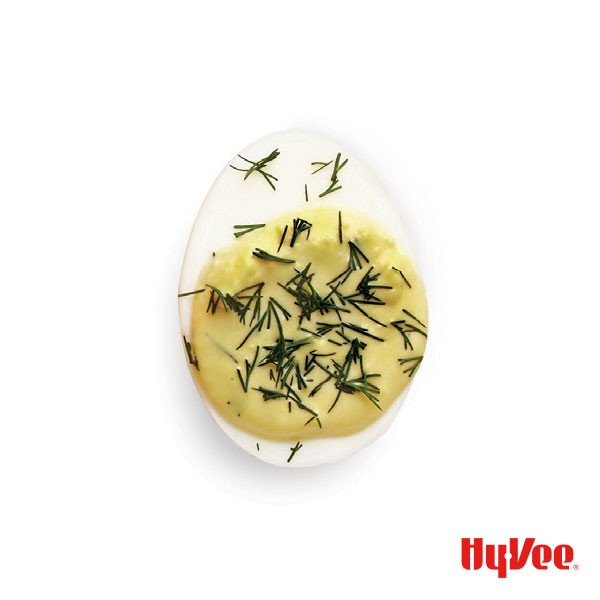 Creamy dill deviled egg topped with fresh dill