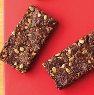 Dried fruit and nut bars on a red background