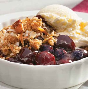 Cherry-blueberry-coconut crisp served with side of vanilla ice cream