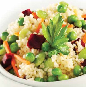 Couscous filled with diced beets, shredded carrots, green peas and topped with Italian parsley leaves