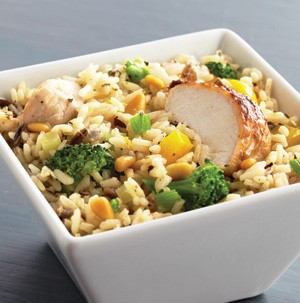 White square bowl of chicken and broccoli rice pilaf