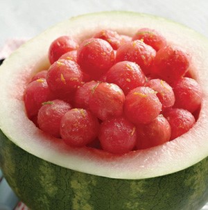 Fresh watermelon balls served in a hollowed watermelon bowl