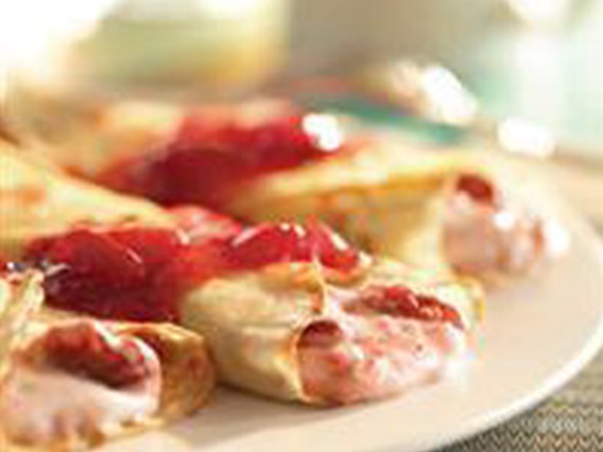 Strawberries and Cream Crepes with Raspberry Sauce