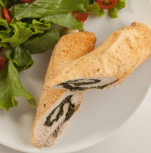 Plate of chicken and mozzarella wrap-up with side salad
