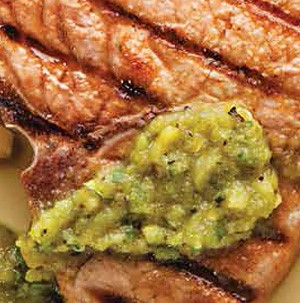 Grilled steak topped with green salsa