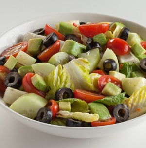 Chopped cucumbers, lettuce, halved cherry tomatoes and sliced black olives