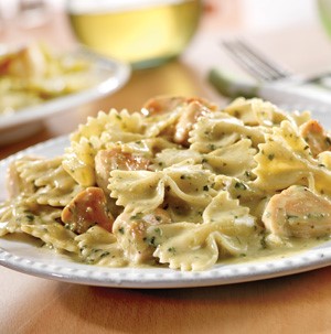 Plate of creamy pesto chicken and bow ties
