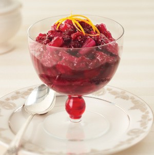 Bowl of cranberry-raspberry relish, served with a spoon