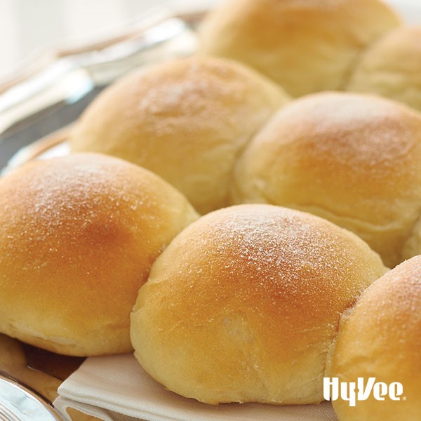 Platter of baked buns dusted with flour