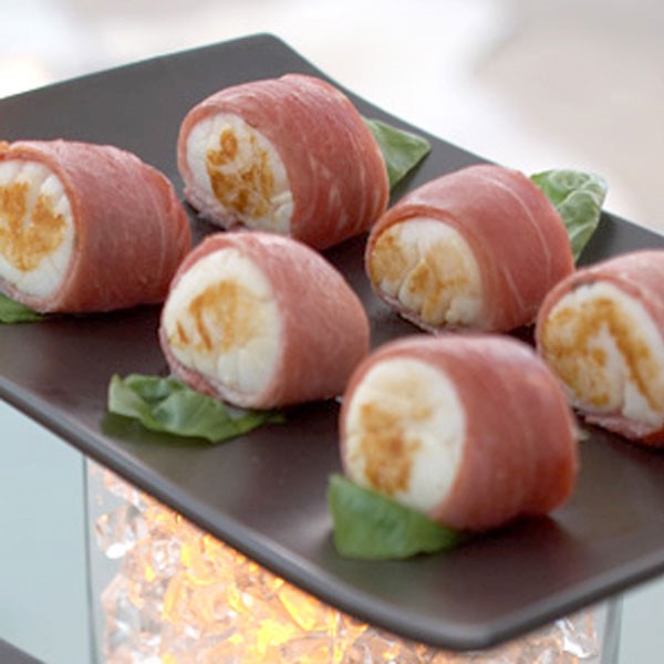 Tray of prosciutto-wrapped scallops