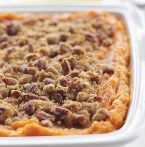 Sweet potato casserole topped with brown sugar, butter and pecans
